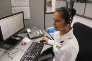 woman with headphones at computer