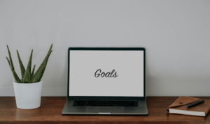 laptop; screen says "goals"