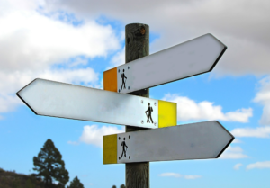 signposts for hikers pointing in three different directions