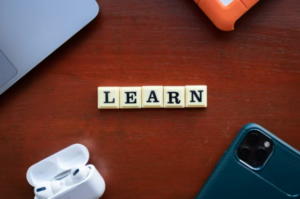 tiles on a table that spell the word "learn"