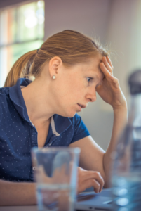 woman concentrating on laptop screen