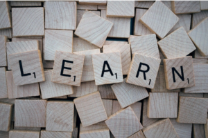 scrabble tiles spelling "learn"