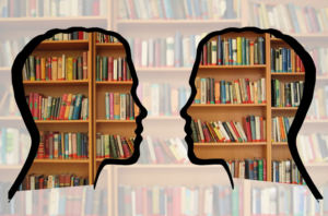 silhouette of two heads looking at one another; books on bookshelves are inside of the silhouettes
