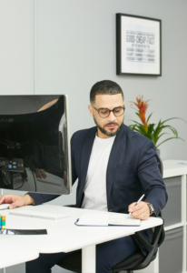 man at desk with computer