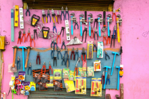 colorful tools hanging on a wall