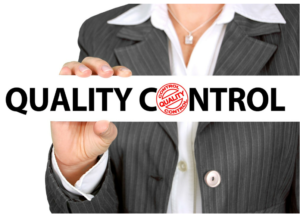 businesswoman holding a sign that says "quality control"
