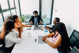 professionals in discussion, sitting at a table