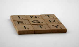 scrabble tiles spelling the word "integrity"