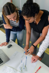 co-workers looking at a report