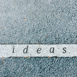 the word "ideas" painted on pavement